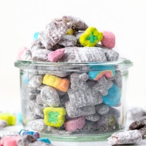 Looking straight on at a jar of Lucky Charms Puppy Chow.