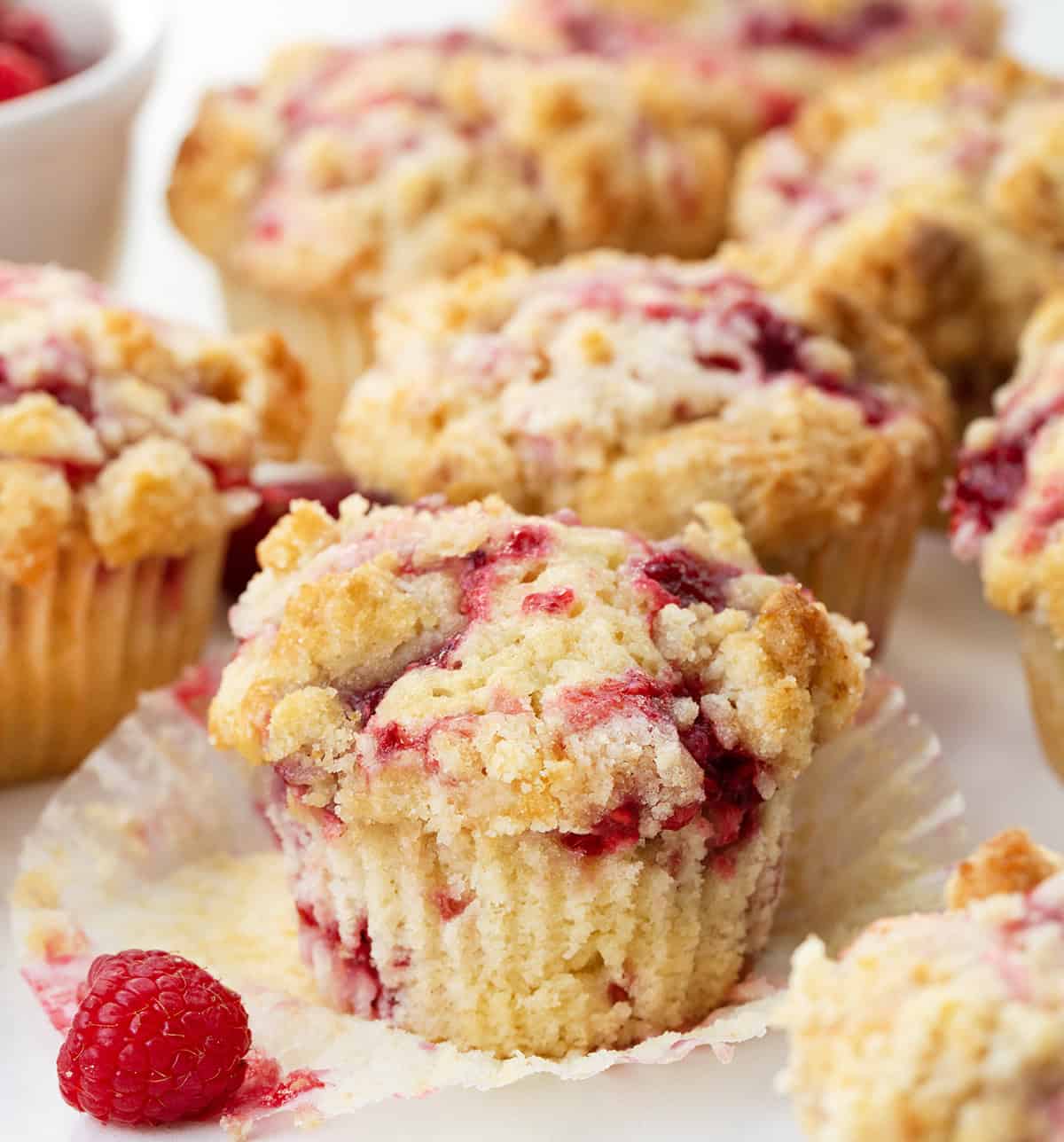 Close up of unwrapped Double Raspberry Muffin.