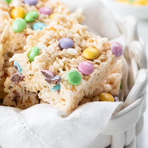 Close up of Easter Rice Krispie Treat in a white glass basket.