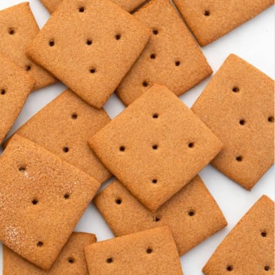 Homemade Graham Crackers laid out on a white table.