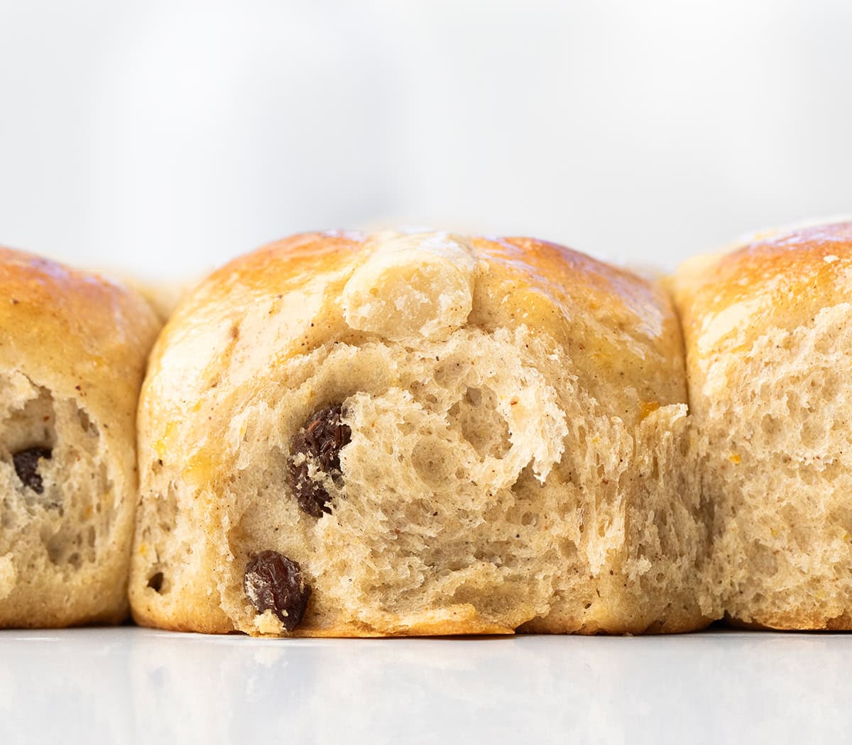 Close up of the side of a Hot Cross Bun.