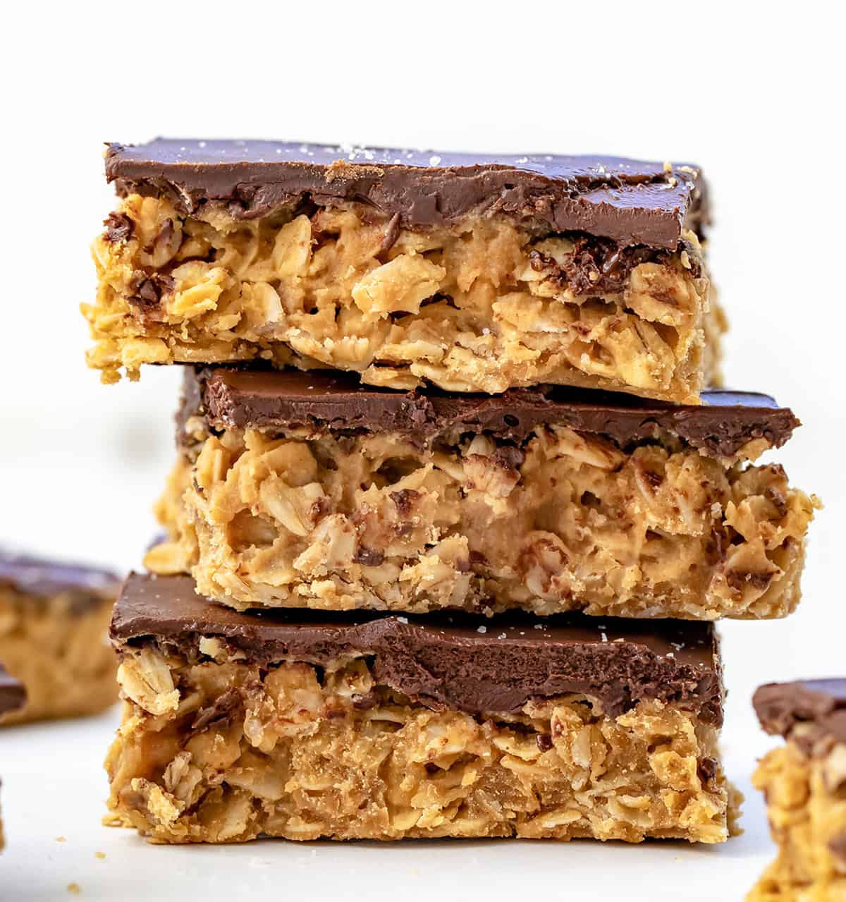 Stack of No-Bake Peanut Butter Oat Bars very close up.