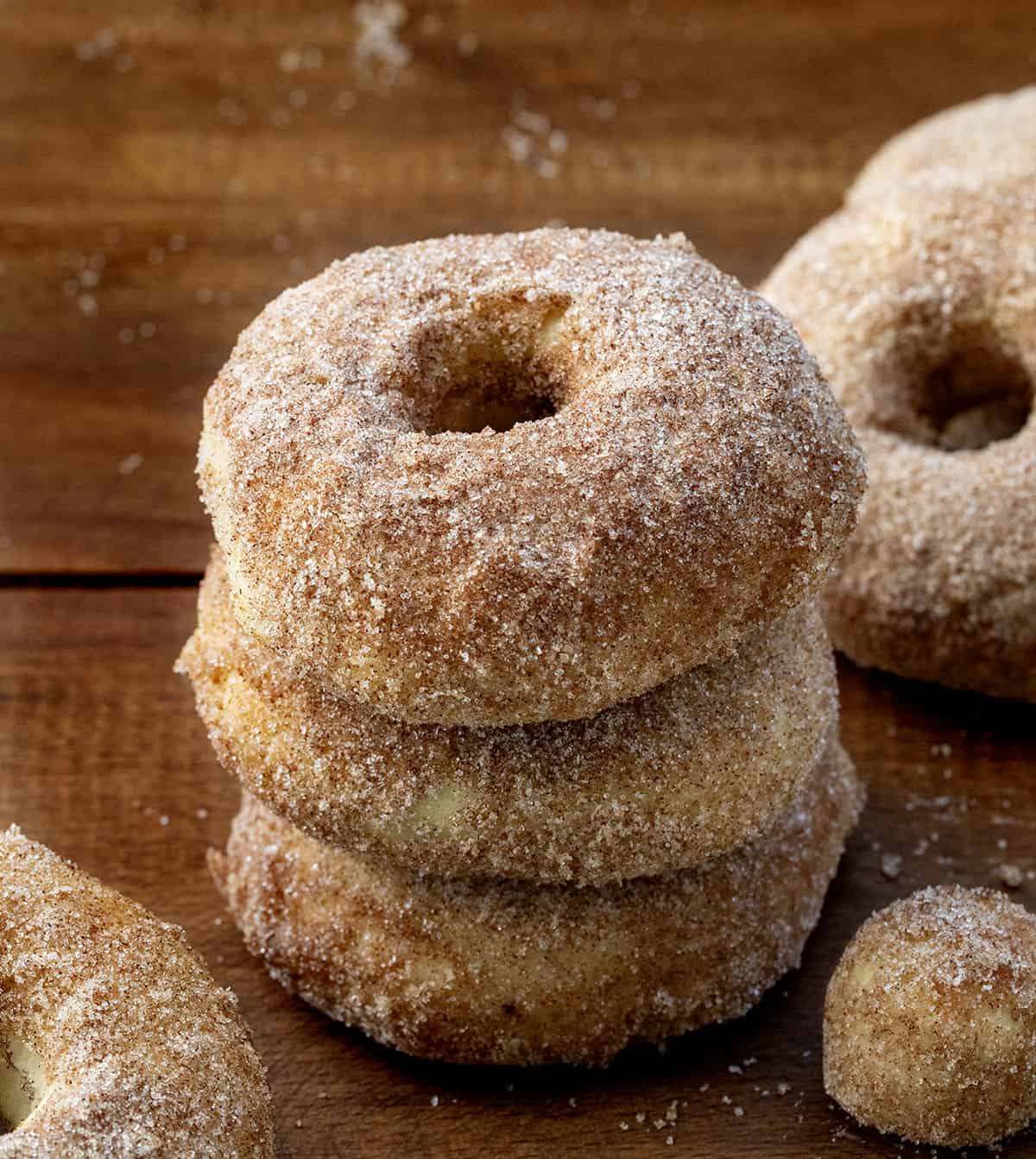 Stack of Baked Donuts on a wooden table.