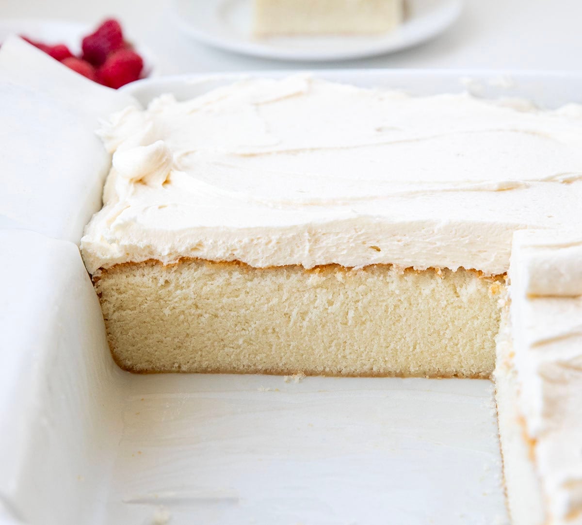 Best White Sheet Cake with half the cake removed showing the texture.