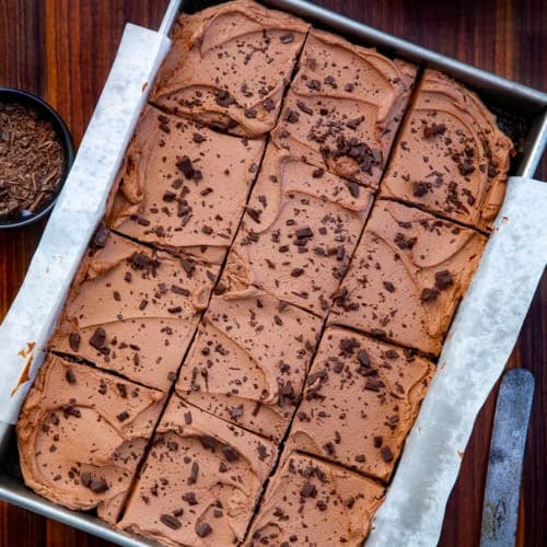 Chocolate Sheet Cake on a wooden table from overhead.