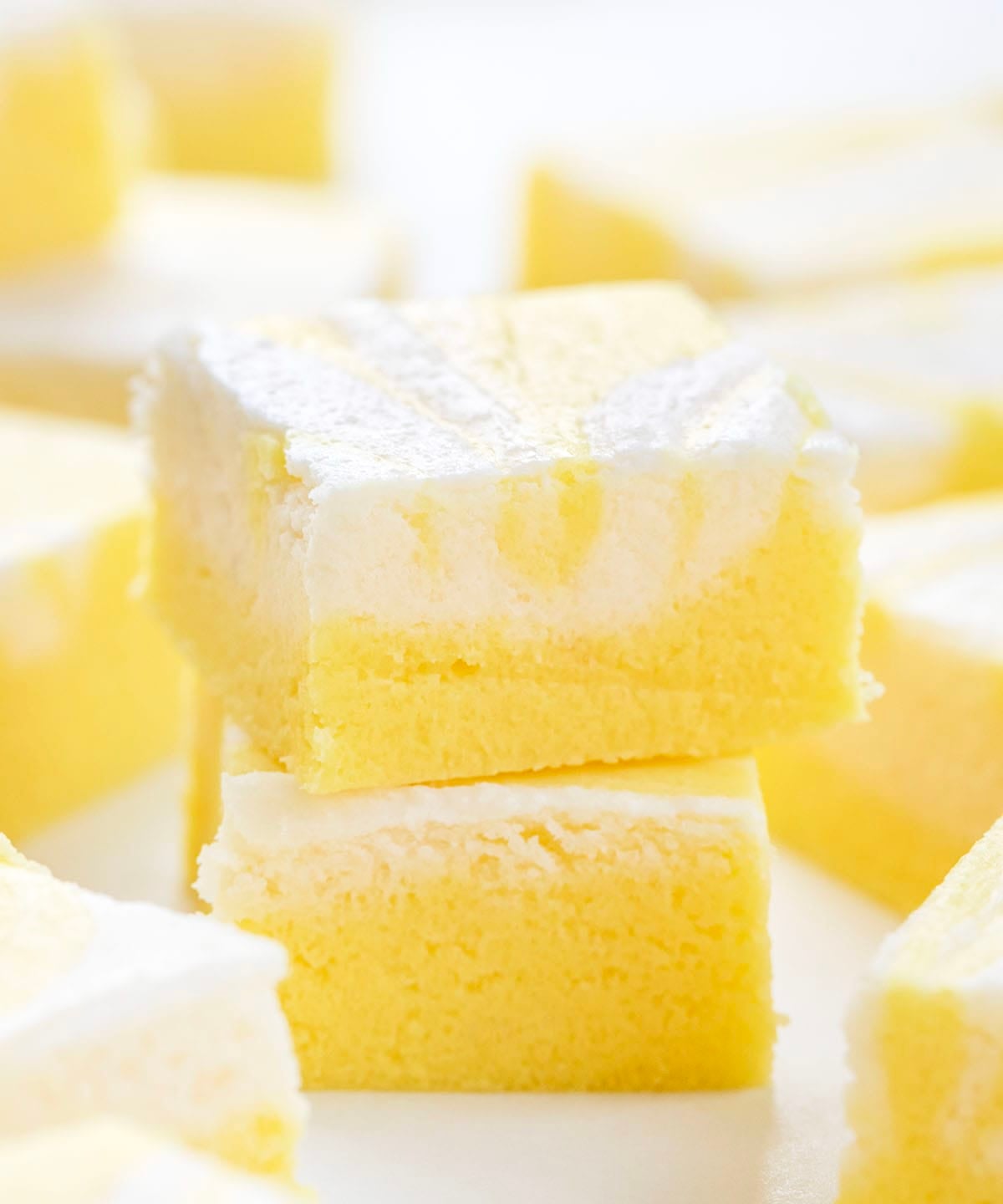 Pieces of Lemon Creamsicle Fudge on a white table.