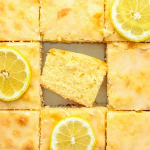 Cut up Lemon Sheet Cake with the center piece on its side.