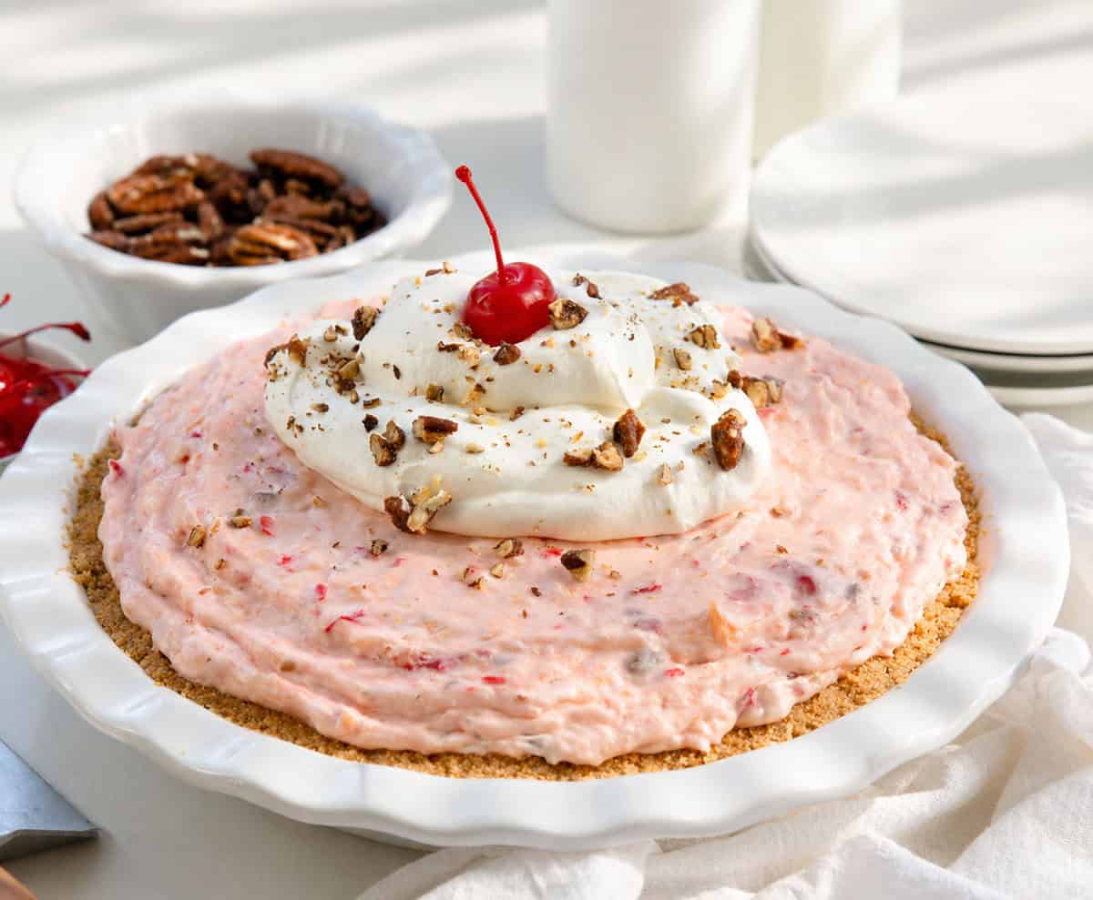 Millionaire Pie in a white pie plate on a white table.