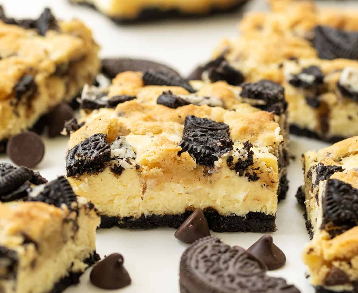 Close up of Oreo Chocolate Chip Cheesecake Bar surrounded by more bars.