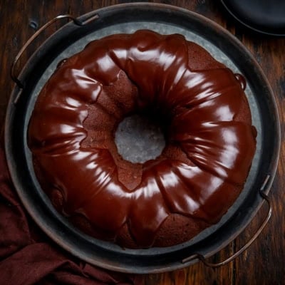 Triple Chocolate Pound Cake covered in glossy chocolate ganache from overhead.