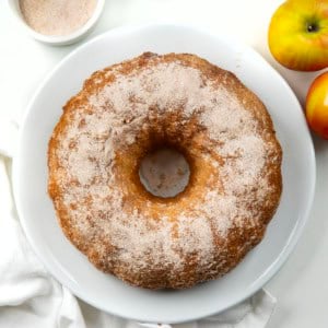 Apple Cider Donut Bundt Cake on a white table from overhead.