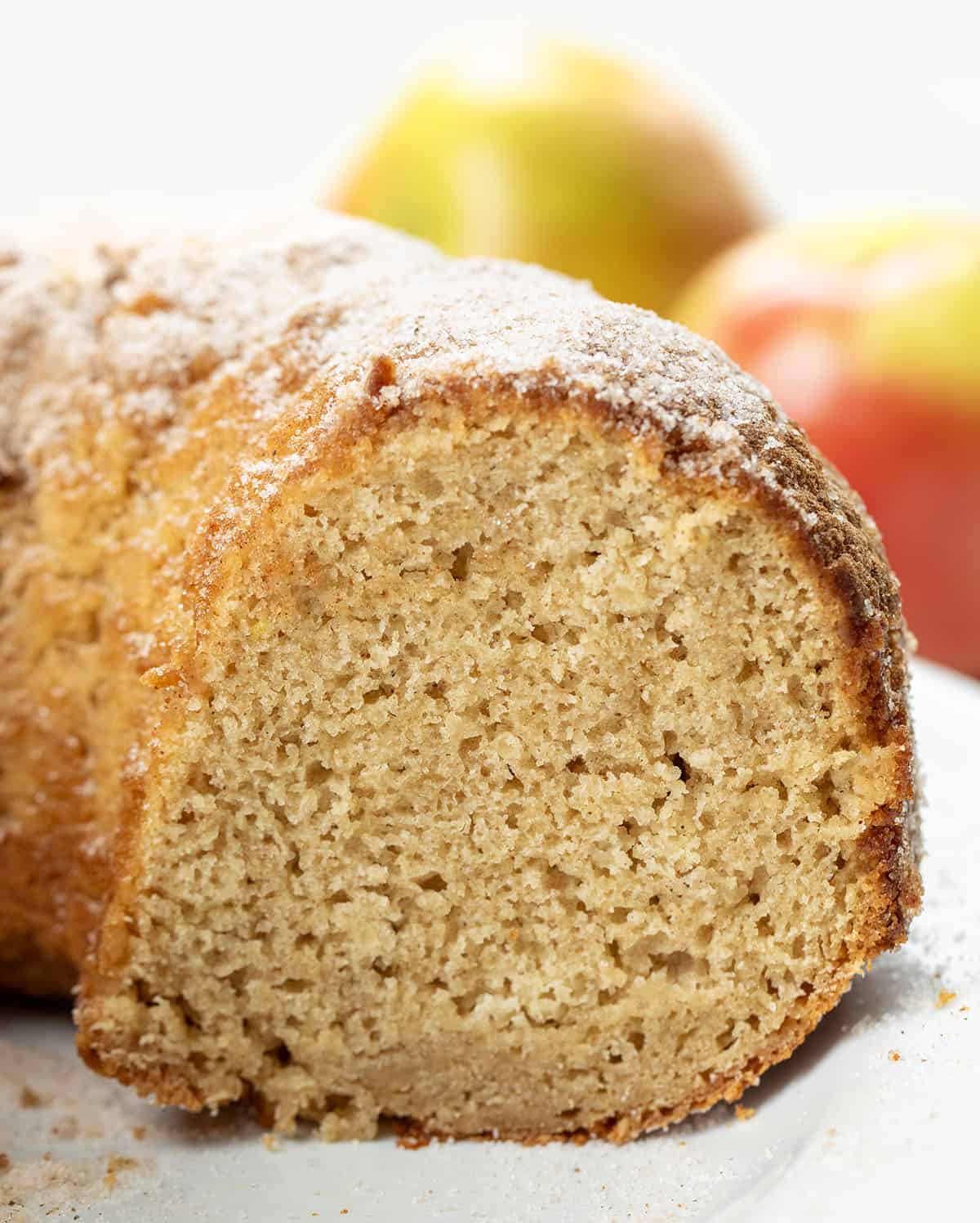 Cut into Apple Cider Donut Bundt Cake showing the inside texture of the cake.
