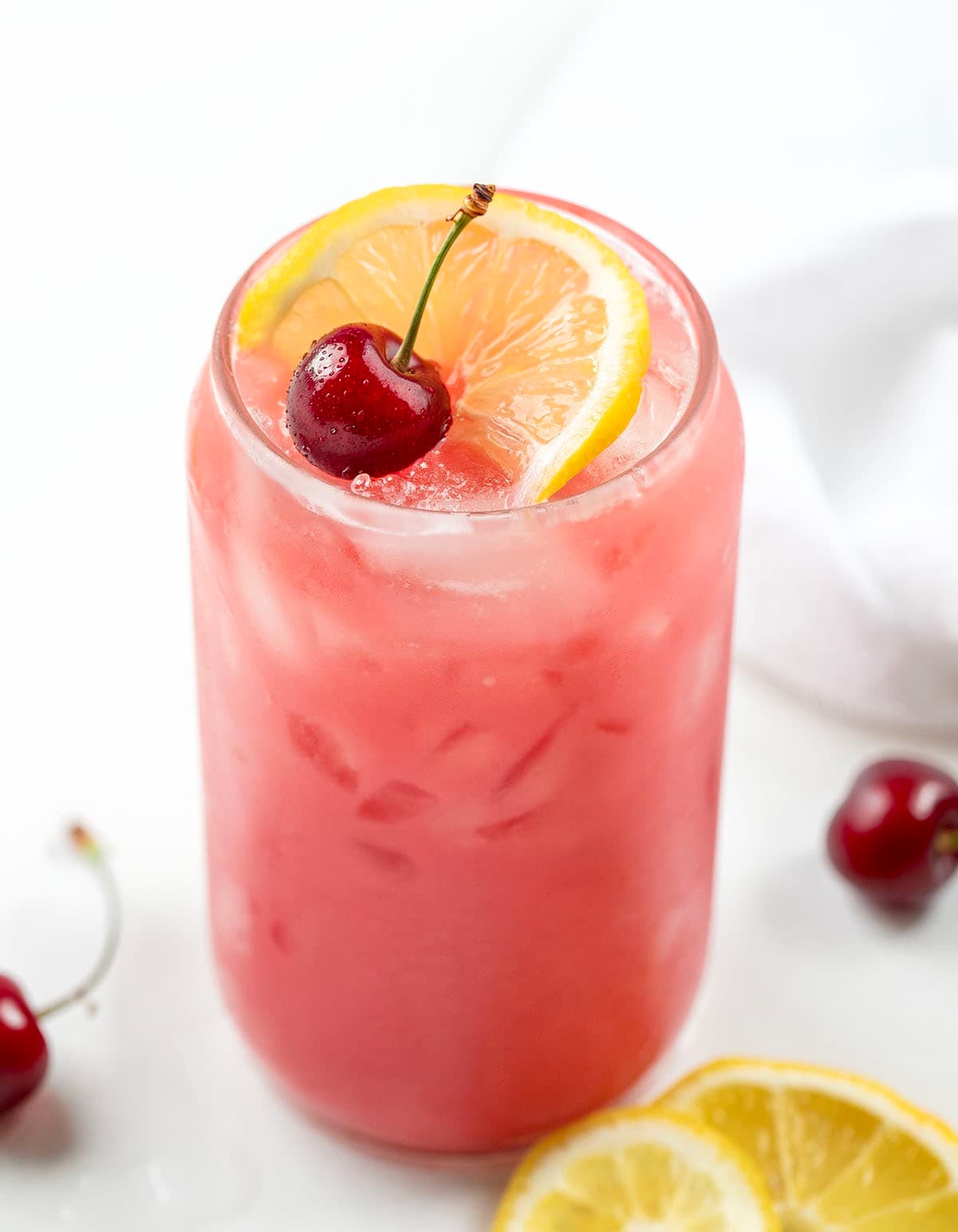 Close up of a glass of Creamy Cherry Lemonade.