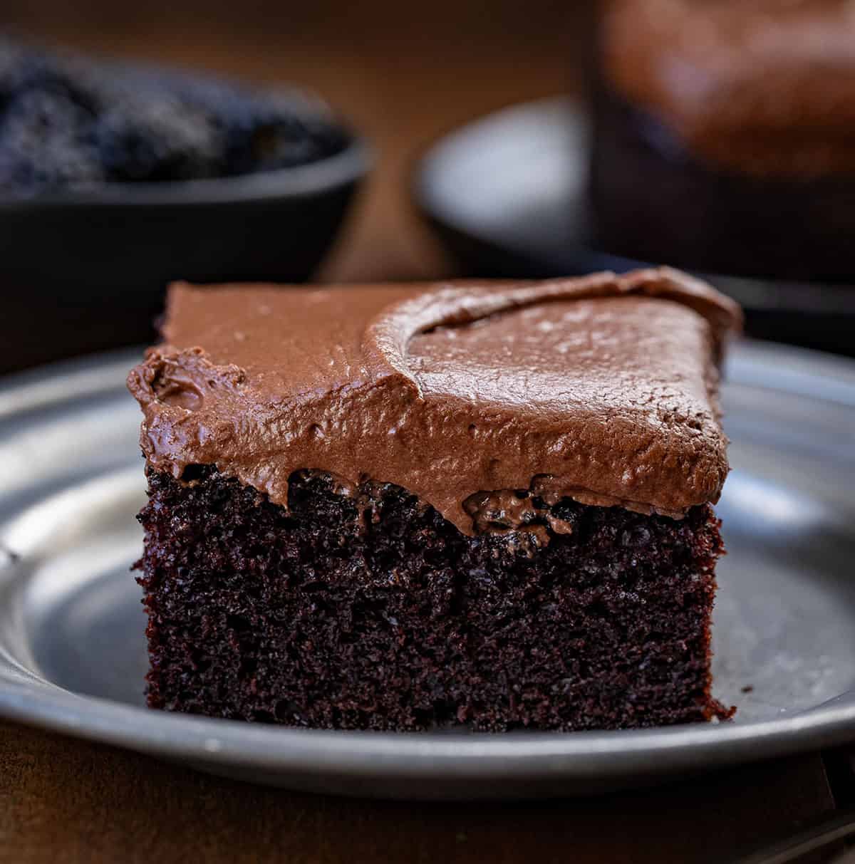 Close up of a piece of Devil's Food Sheet Cake on a plate.