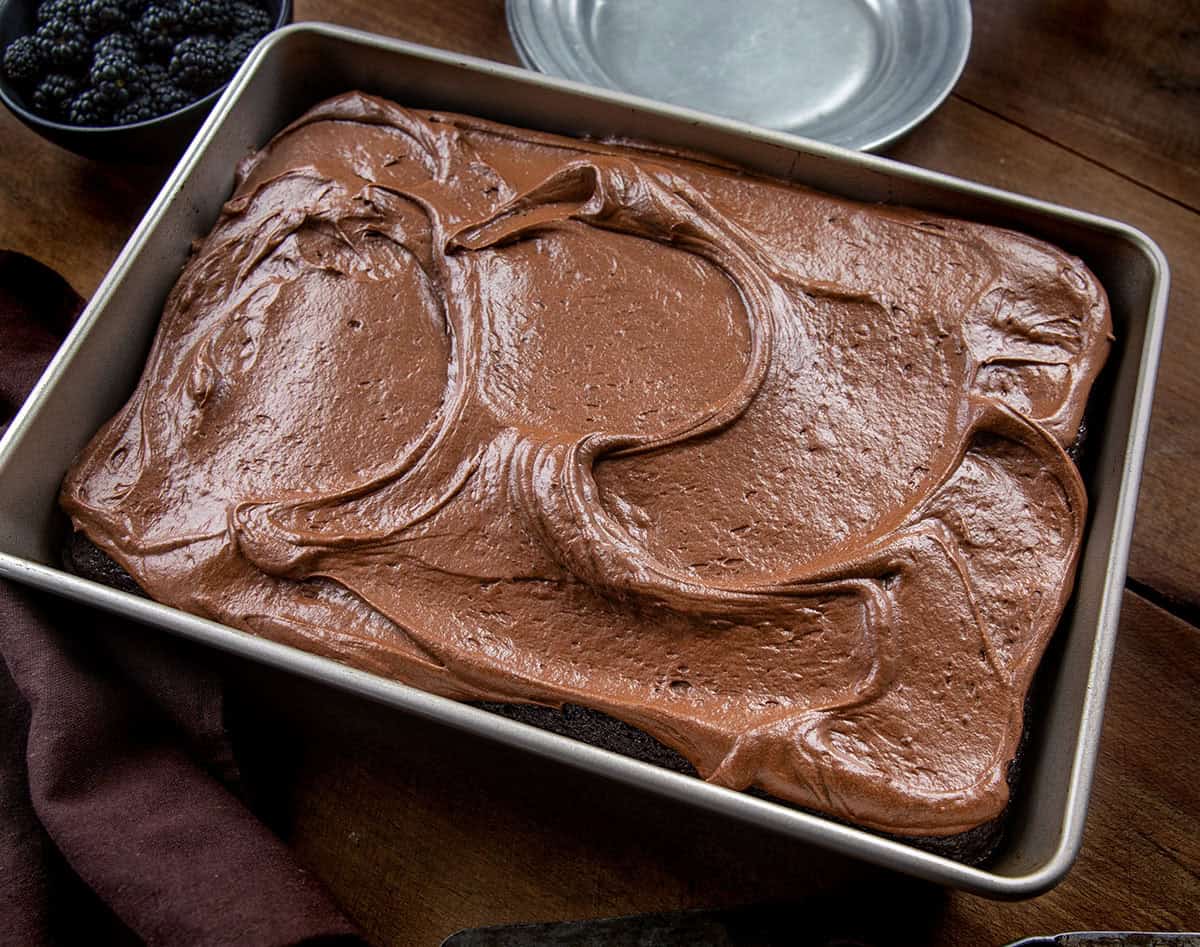 Pan of Devil's Food Sheet Cake on a wooden table.