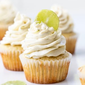 Key Lime Cupcakes with Key Lime Ermine and a fresh lime slice in the frosting.