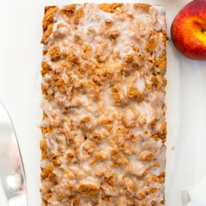 Loaf of Peach Cobbler Bread on a white table from overhead.