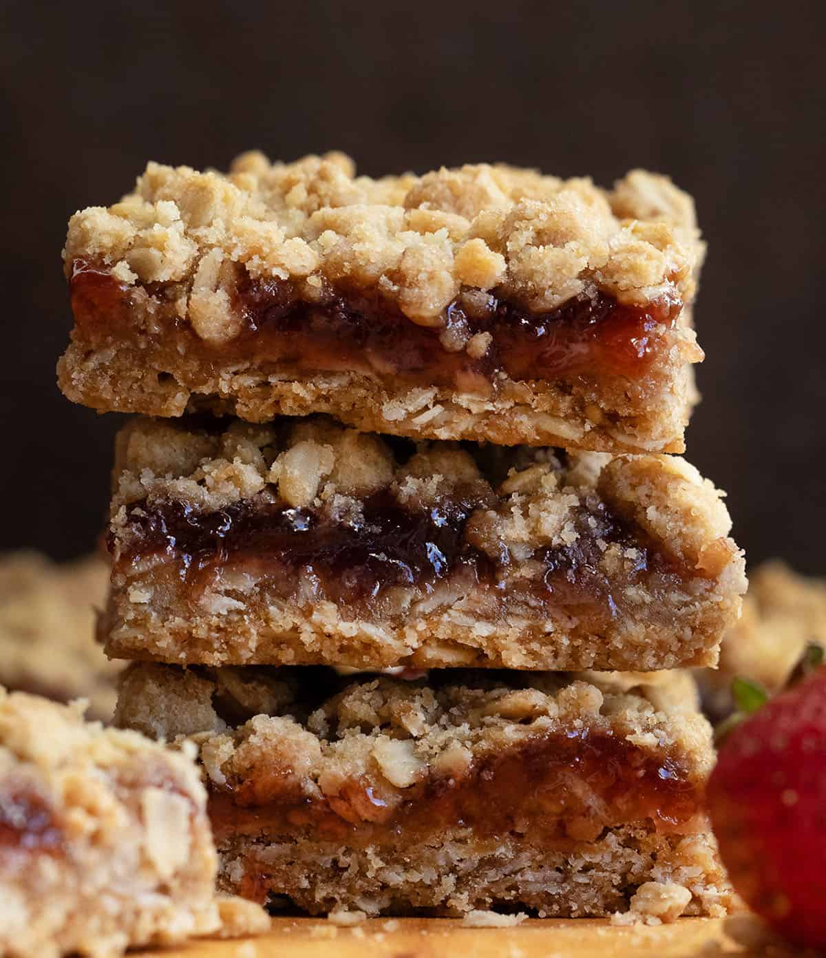 Close u p of a stack of Strawberry Oatmeal Crumble Bars showing layers.