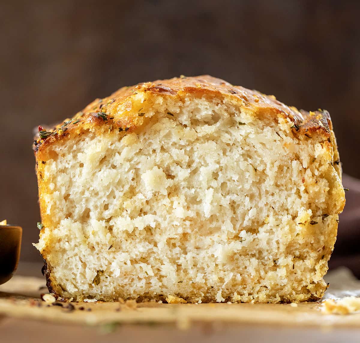 Close up of a loaf of Cowboy Butter Swim Bread showing tender crumb inside.