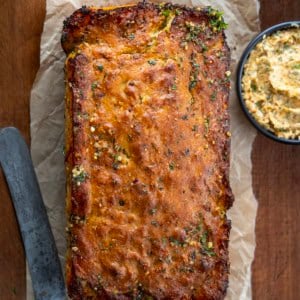 Loaf of Cowboy Butter Swim Bread on a wooden table from overhead.