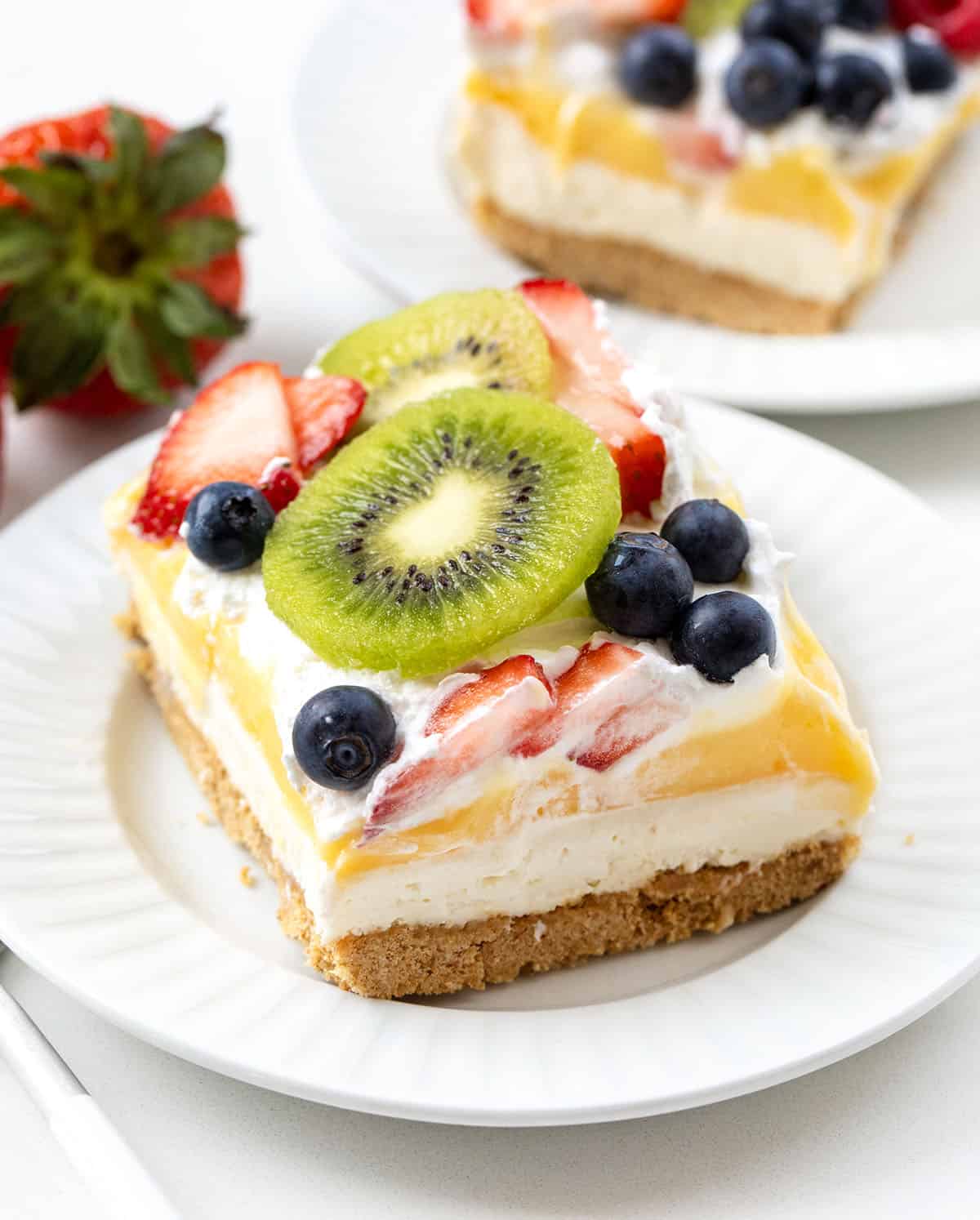 Mixed Berry Lush pieces on white plates on a white table.