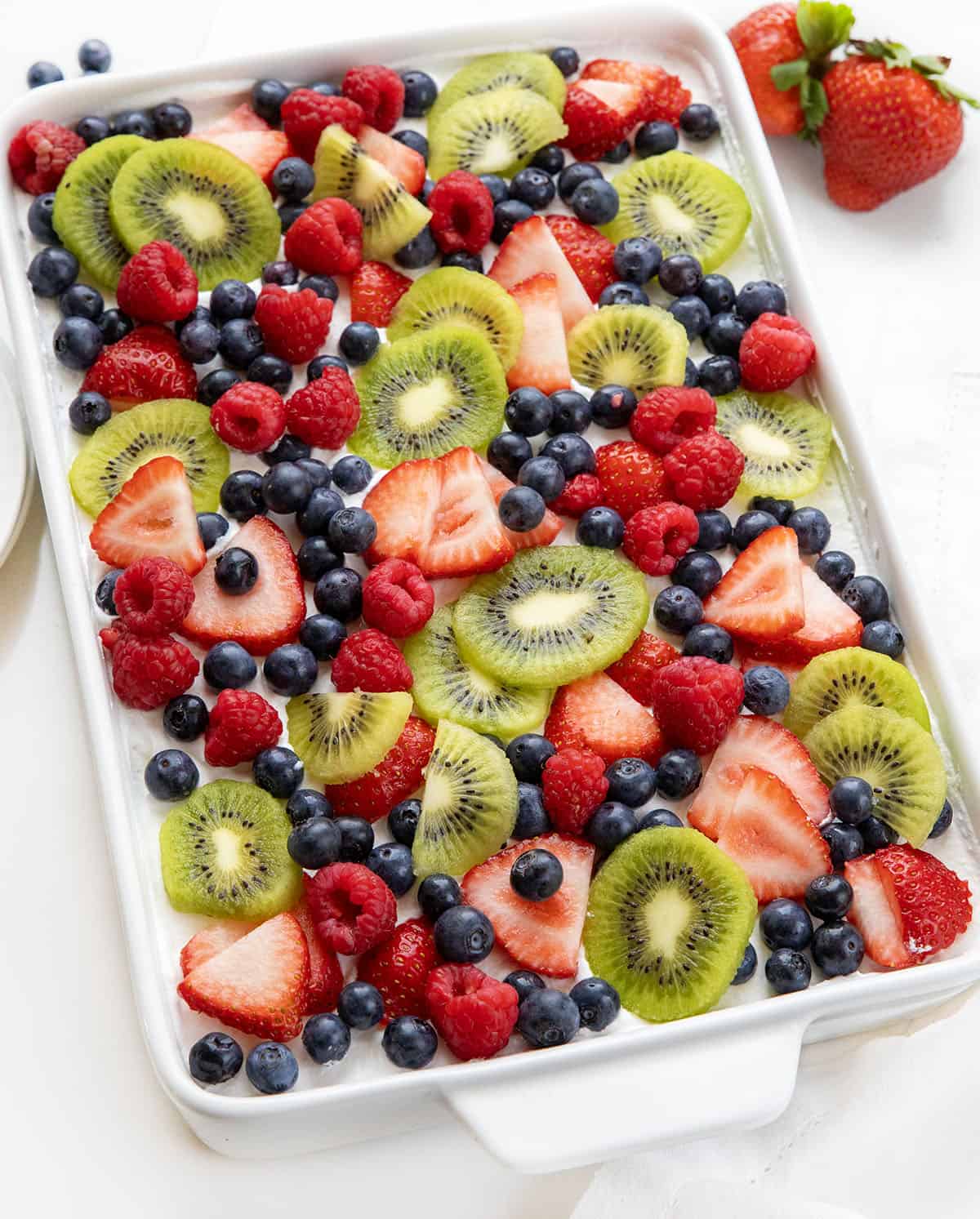 Mixed Berry Lush in a white pan on a white table.