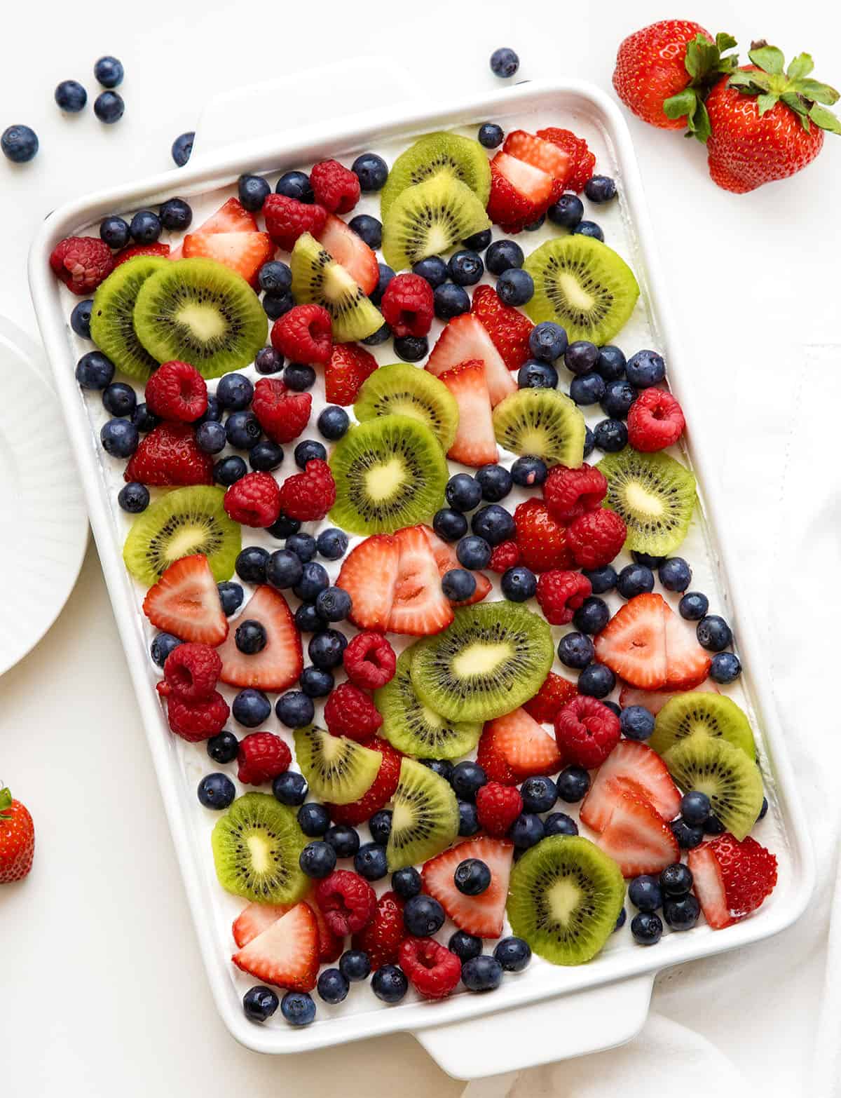 Mixed Berry Lush in a white pan on a white table.
