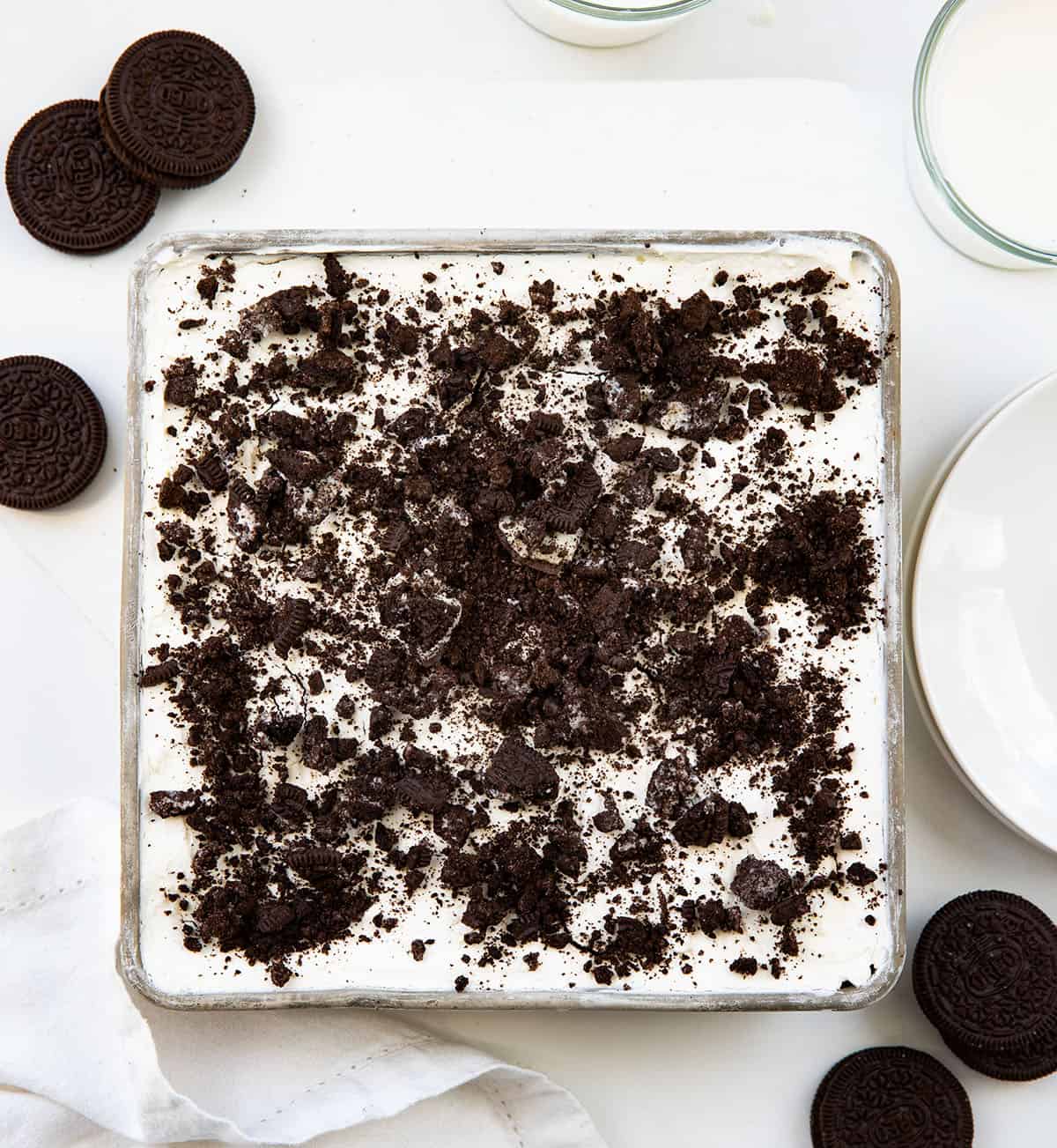 Pan of Oreo Icebox Cake on a white table from overhead.