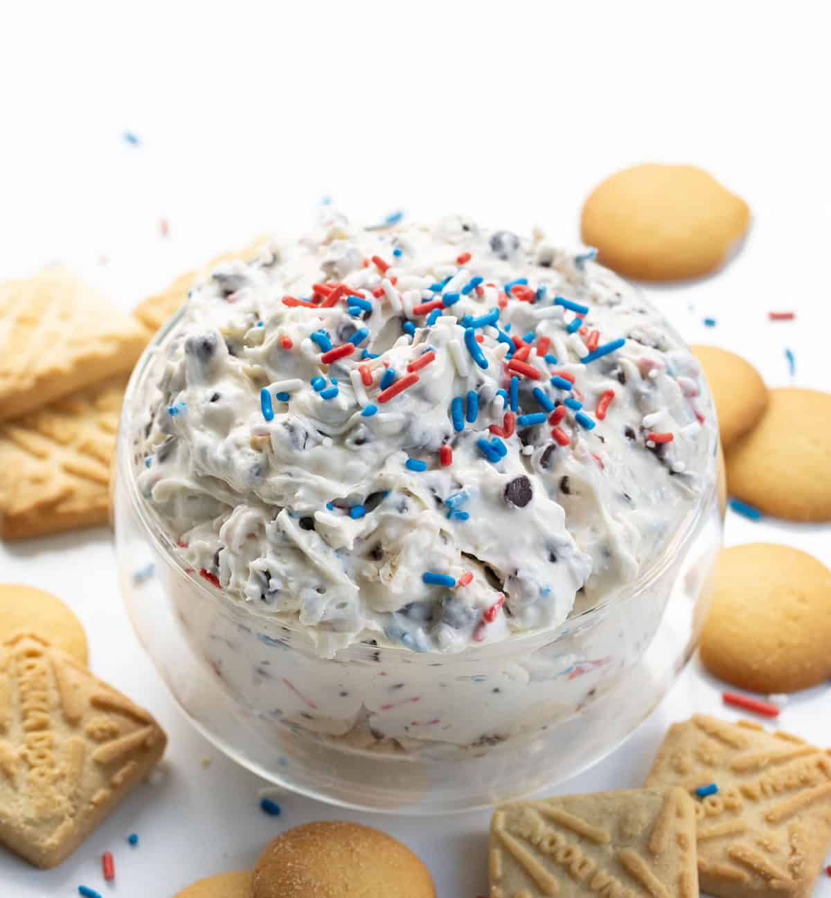 Bowl of Patriotic Booty Dip surrounded by crackers.