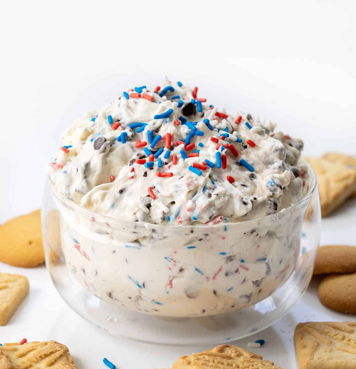 Glass bowl filled with Patriotic Booty Dip, or Patriotic Chocolate Chip Dip.