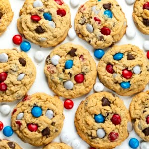 Patriotic Monster Cookies on a white table from overhead.