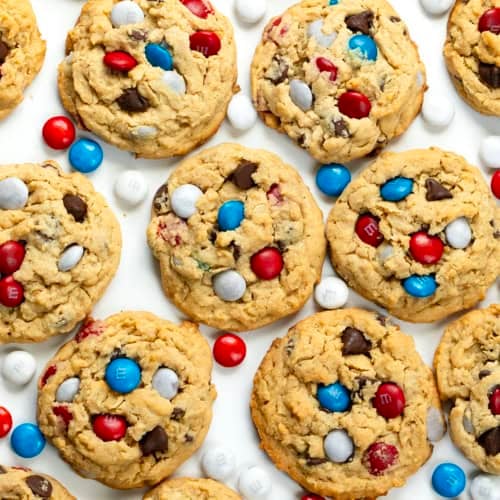 Patriotic Monster Cookies on a white table from overhead.