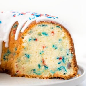 Cut into Red, White, and Blue Pound Cake showing tender crumb and bursts of red and blue.