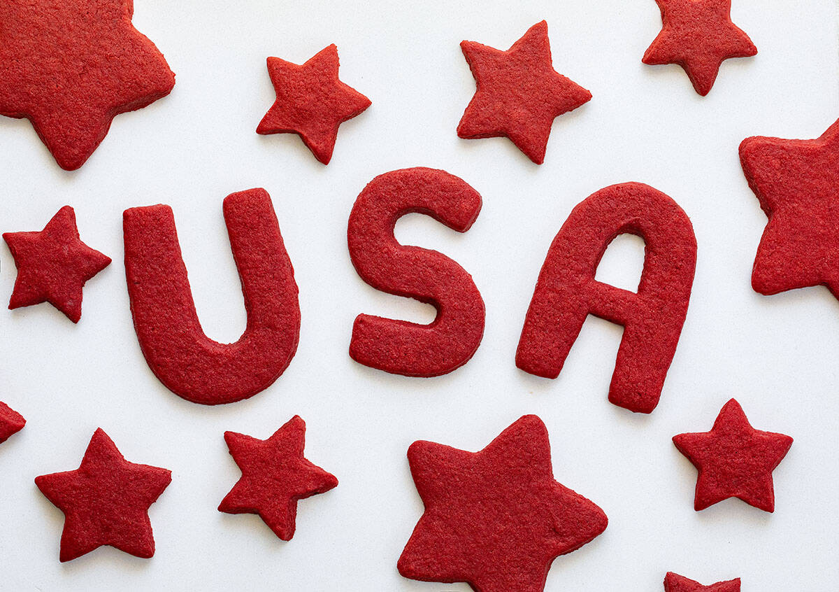 Red Velvet Cut-Out Sugar Cookies with the letters USA and star shaped cookies.