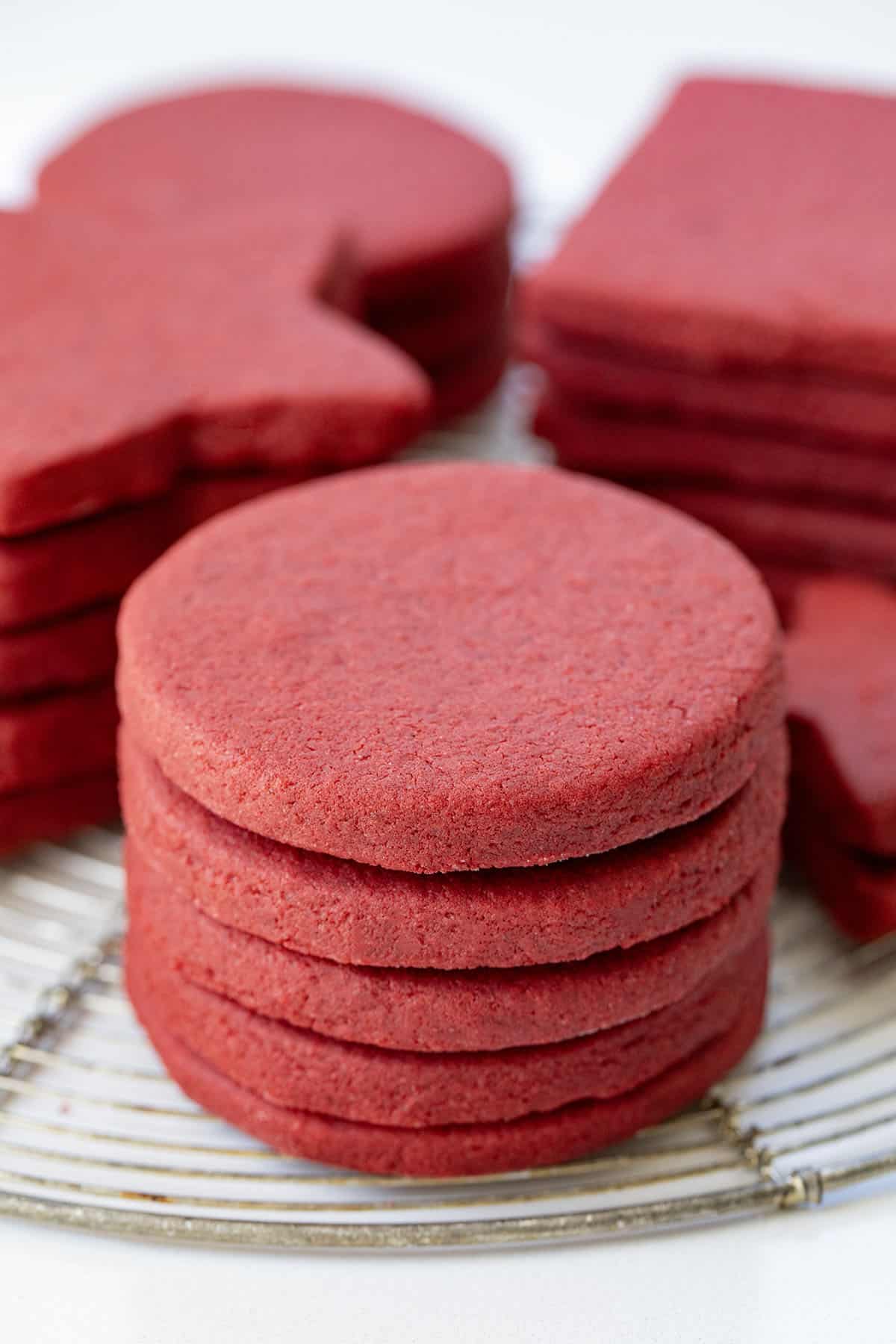 Close up of stacks of Red Velvet Cut-Out Sugar Cookies.