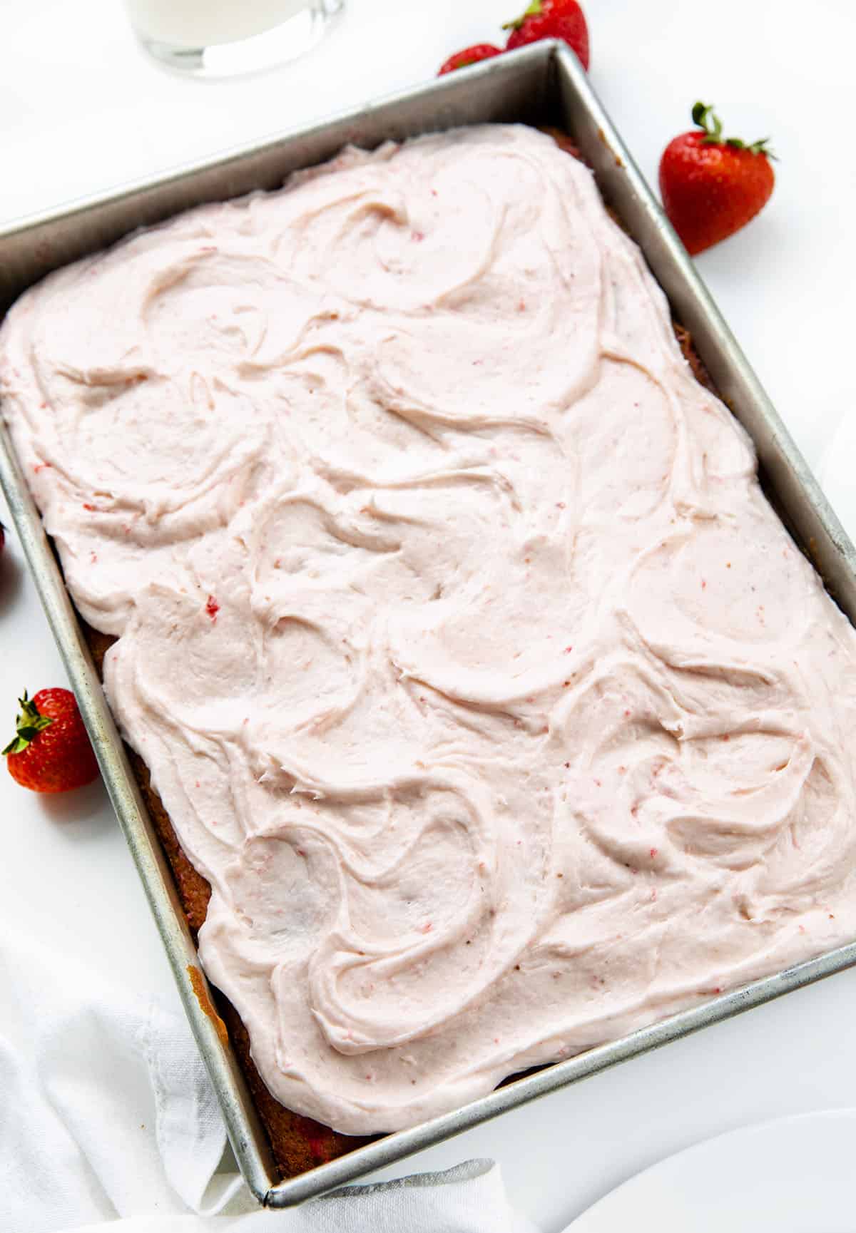 This Strawberry Sheet Cake with Cream Cheese Frosting is soft, fluffy, and packed with real strawberry flavor in every bite. The cake gets its flavor from a simple strawberry puree baked right in, then it’s finished with a creamy strawberry cream cheese frosting that makes it feel extra special without being fussy!