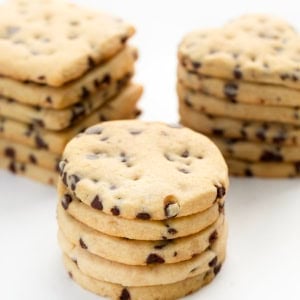 Stacks of circles, hearts, and squares of Chocolate Chip Cut-Out Cookies.