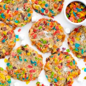 Fruity Pebbles Cookies laid out on a white table from overhead.