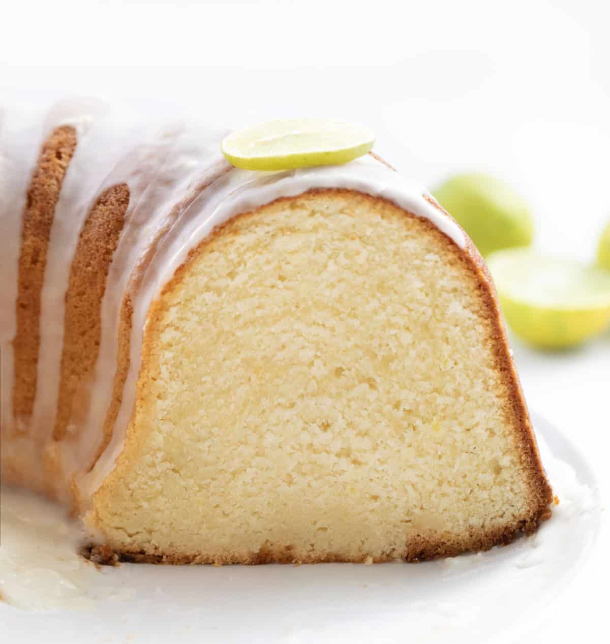 Cut into Key Lime Pound Cake showing the tender texture inside Cut into Key Lime Pound Cake showing the tender texture inside.