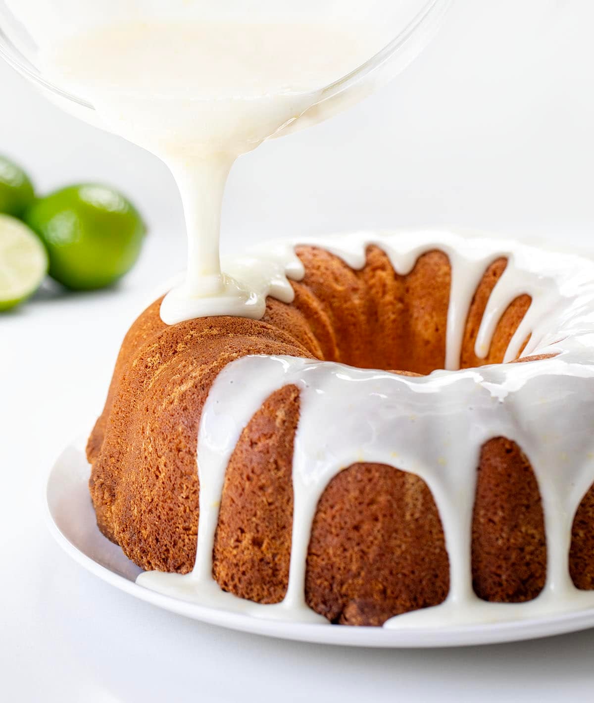 Drizzling key lime glaze over a Key Lime Pound Cake Drizzling key lime glaze over a Key Lime Pound Cake.