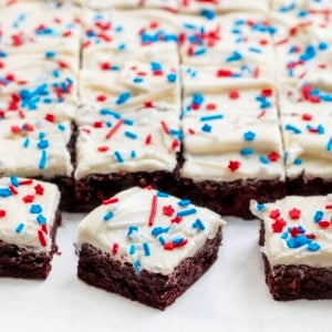 Patriotic Red Velvet Sheet Pan Brownies cut into squares with a few pulled away from the others.