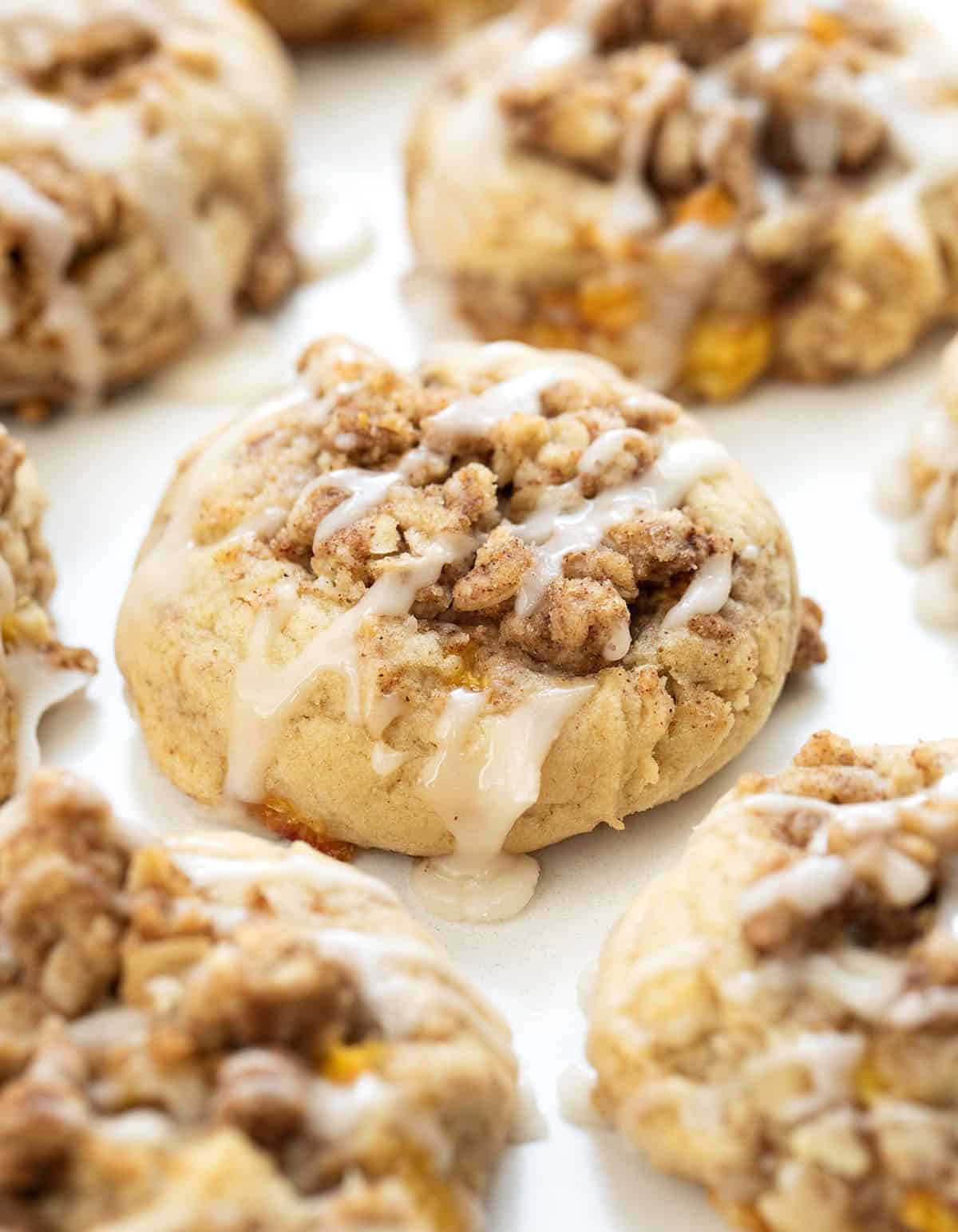 Close up of Peach Crisp Cookies on a white table.