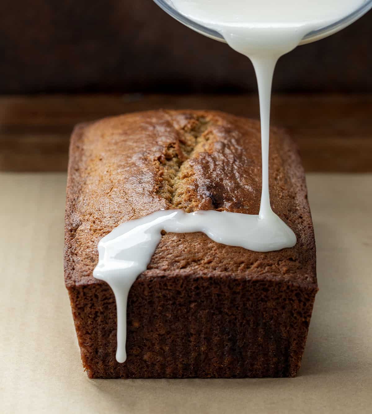 Drizzling apple cider glaze over Apple Butter Bread Drizzling apple cider glaze over Apple Butter Bread.