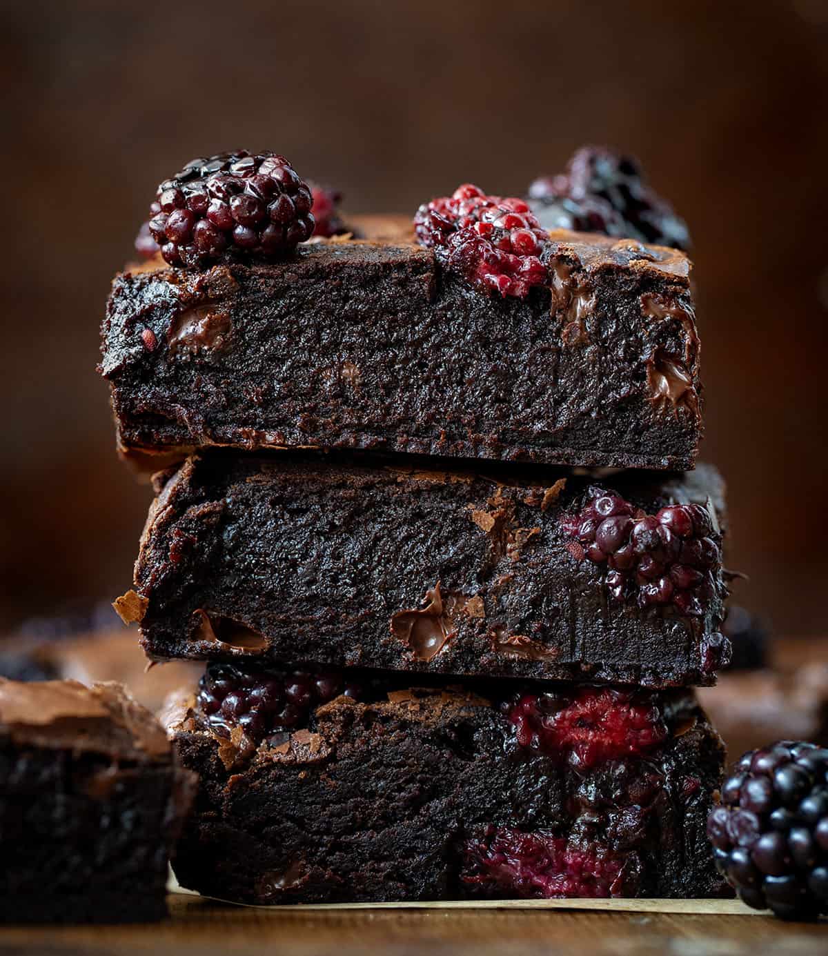 Stack of Blackberry Balsamic Brownies on a wooden table close up Stack of Blackberry Balsamic Brownies on a wooden table close up.
