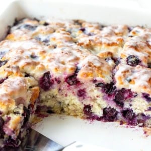 Baking dish with Blueberry Lemon Butter Swim Biscuits but half have been removed.