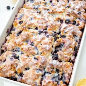 Close up of Blueberry Lemon Butter Swim Biscuits in a white pan.