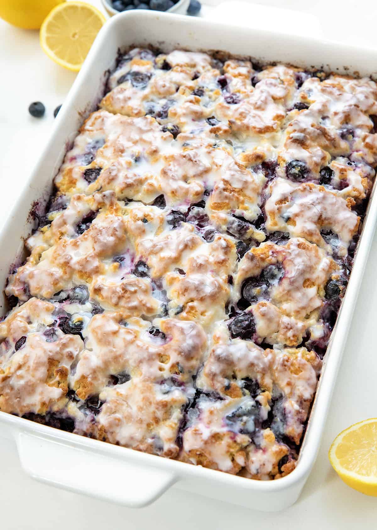 Close up of Blueberry Lemon Butter Swim Biscuits in a white pan.