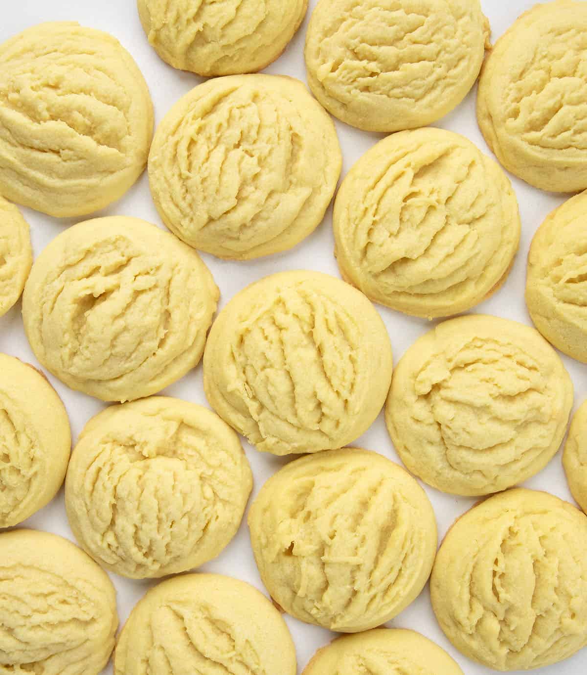 Lemon Sugar Cookies on a white table from overhead Lemon Sugar Cookies on a white table from overhead.