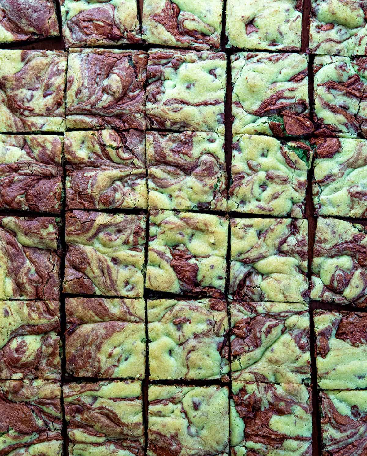 Mint Chocolate Chip Brookies cut into sqaures on a wooden table from overhead.