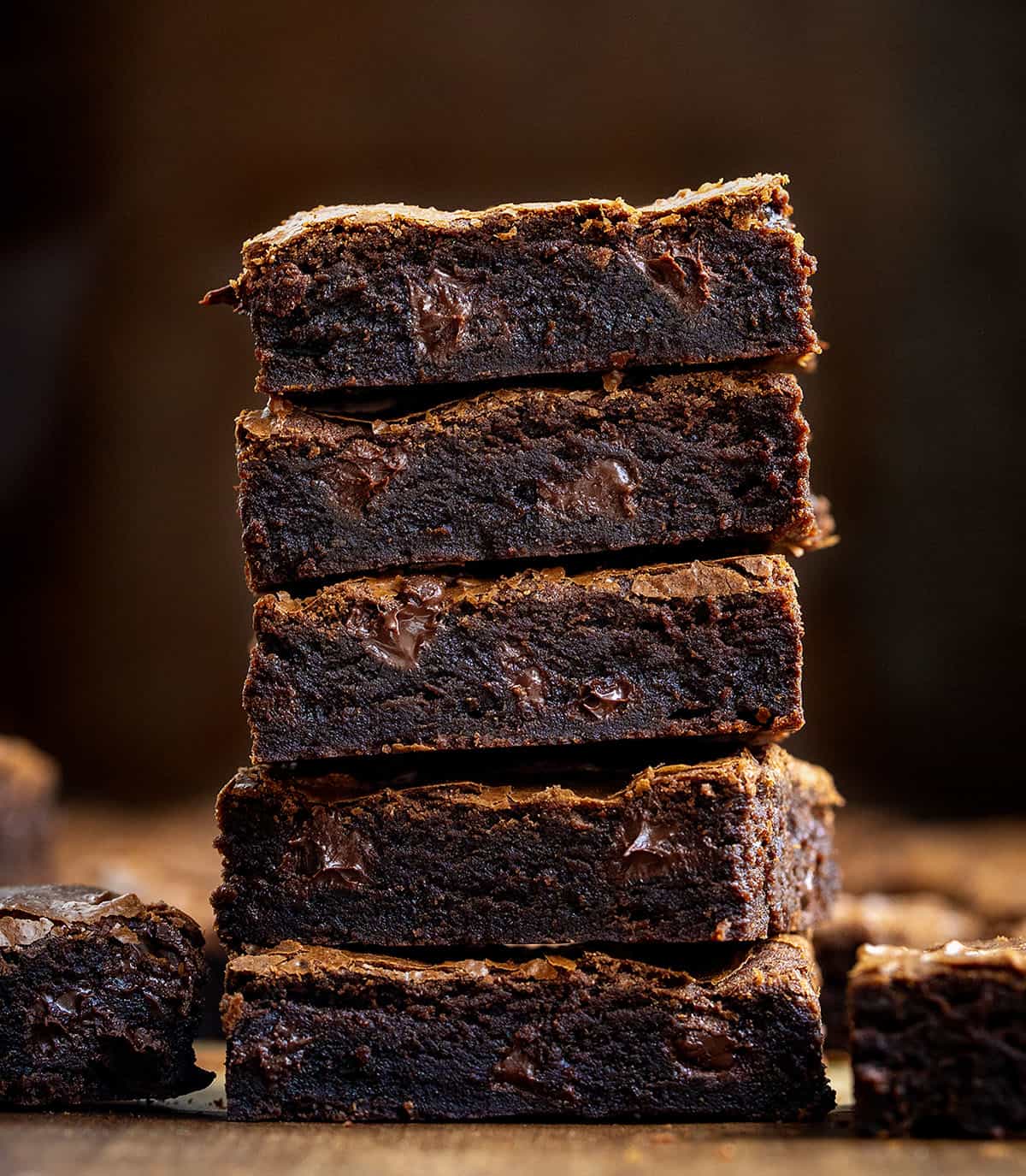 Stack of Sheet Pan Brownies on a wooden table close up Stack of Sheet Pan Brownies on a wooden table close up.
